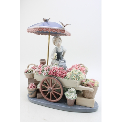 Lladro porcelain figure 'Flowers of the Season' no. 01454, with wooden plinth and box, 30cm tall.