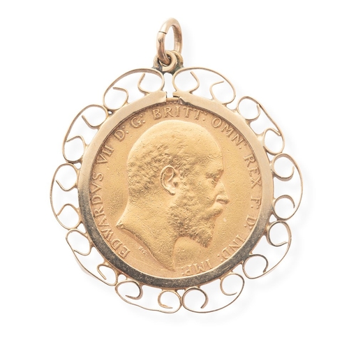 37 - An Edward VII gold sovereign, 1910, in 9ct gold scroll pendant mount, total weight including mount 1... 