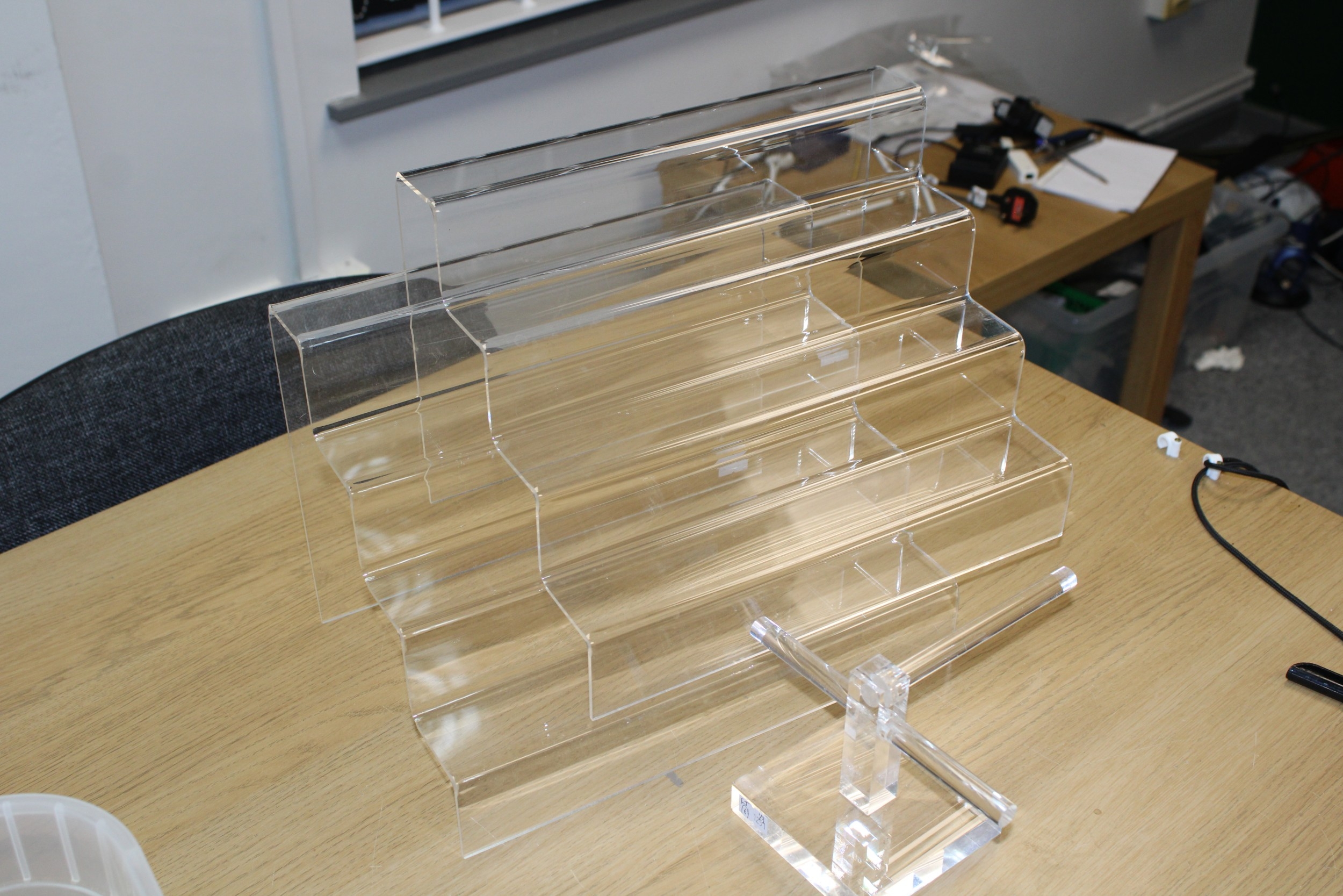 Shop display graduated perspex stepped shelves together with a perspex ...
