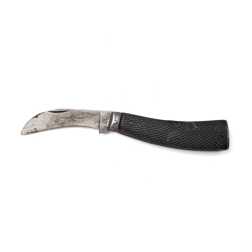 219 - An antique flat cap pruner pocket knife, Sheffield made, makers mark rubbed, blade stamped 'Cross Da... 