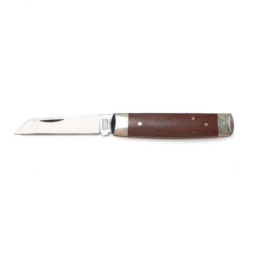 256 - A senator pocket knife with chased workback spring, by A Wright and Son of Sheffield, with wooden ha... 