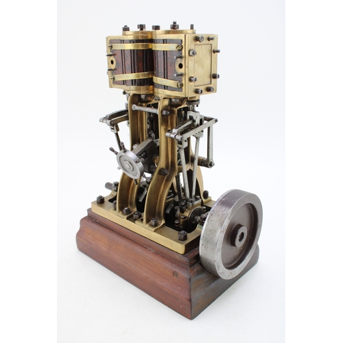 Antique model twin cylinder marine steam engine, as used in model boats, bronze casting on hardwood plinth, c1920s, 26.5cm tall, 20.5cm wide.