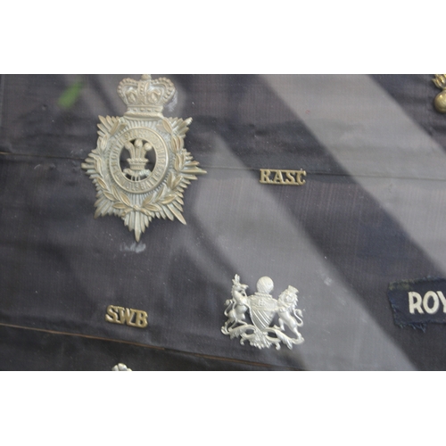 16 - A Framed Collection of British Army Cap Badges Including a Victorian North Staffordshire 1st Volunte... 