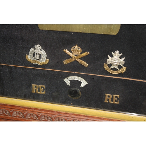 16 - A Framed Collection of British Army Cap Badges Including a Victorian North Staffordshire 1st Volunte... 