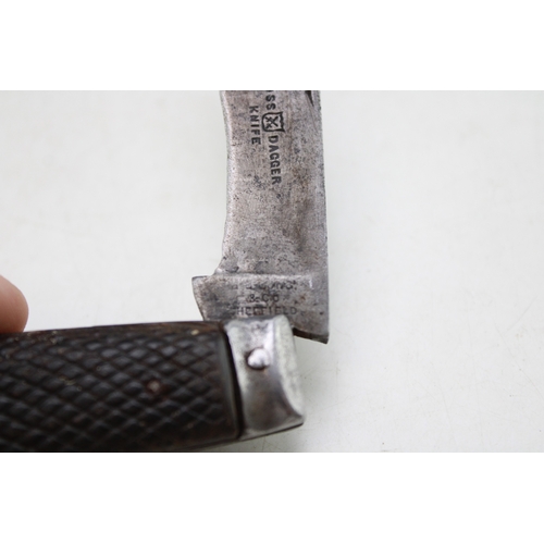 219 - An antique flat cap pruner pocket knife, Sheffield made, makers mark rubbed, blade stamped 'Cross Da... 