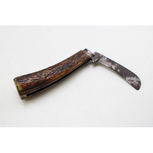 225 - An antique flat cap pruner pocket knife, stag antler, 6.5cm blade, 18cm long.