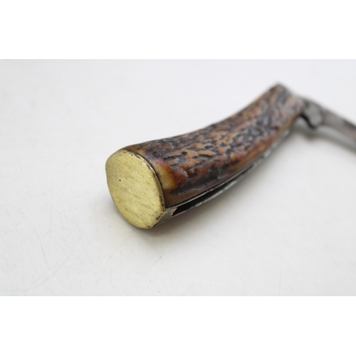 225 - An antique flat cap pruner pocket knife, stag antler, 6.5cm blade, 18cm long.