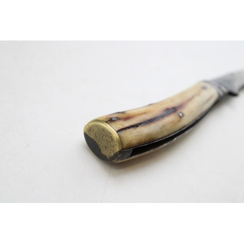 229 - An antique flat cap pruner pocket knife with stag antler handle, kettle engraved to blade, blade 7cm... 