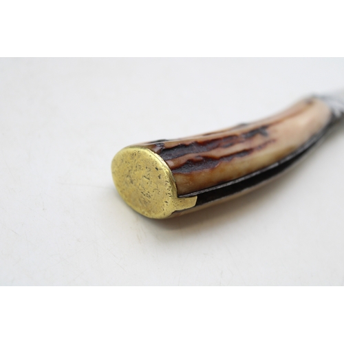 231 - A Sutton & Son antique flat cap pruning pocket knife, engraved with kettle, stag antler handle, blad... 