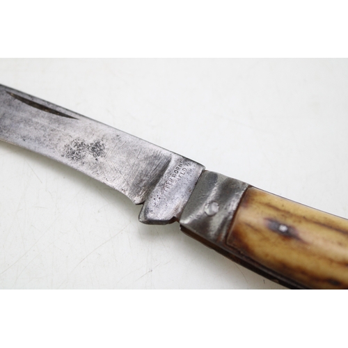 237 - An antique Sheffield-made flat cap pruning pcoket knife, stag antler handle, 7cm blade, 18cm in tota... 
