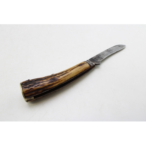 237 - An antique Sheffield-made flat cap pruning pcoket knife, stag antler handle, 7cm blade, 18cm in tota... 