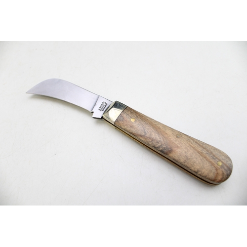 250 - A pruner pocket knife, by A Wright and Son of Sheffield, with olive wood handle, blade 7cm long.