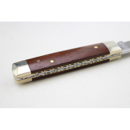256 - A senator pocket knife with chased workback spring, by A Wright and Son of Sheffield, with wooden ha... 