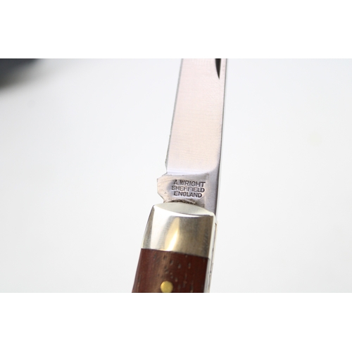 256 - A senator pocket knife with chased workback spring, by A Wright and Son of Sheffield, with wooden ha... 