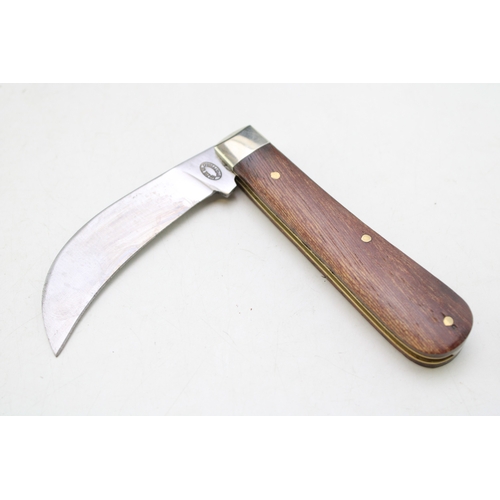 258 - A full pruner pocket knife, by A Wright and Son of Sheffield, with wooden handle, blade 7.5cm long.