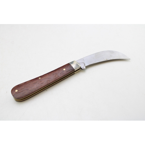 258 - A full pruner pocket knife, by A Wright and Son of Sheffield, with wooden handle, blade 7.5cm long.