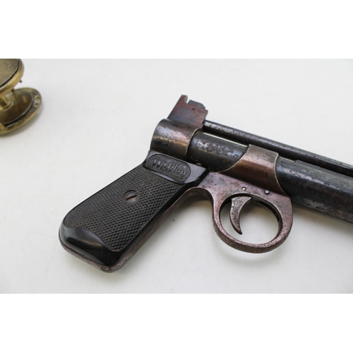27 - Webley 'Junior' .177 air pistol, no. 635, 20cm, long, together with a brass spinner reel with horn h... 