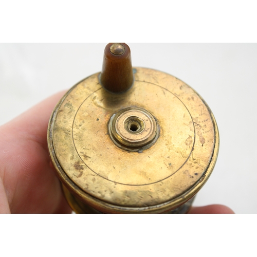 27 - Webley 'Junior' .177 air pistol, no. 635, 20cm, long, together with a brass spinner reel with horn h... 