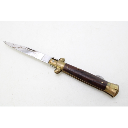 323 - A mid 20th century folding lock knife, made in Italy, in the form of a dagger, blade 7.5cm long, tot... 