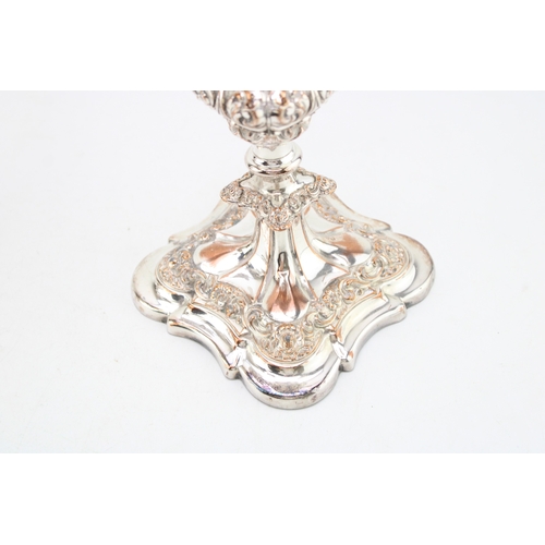 573 - A pair of Sheffield plate or similar three-sconce candelabras with scrolling acanthus leaf decoratio... 