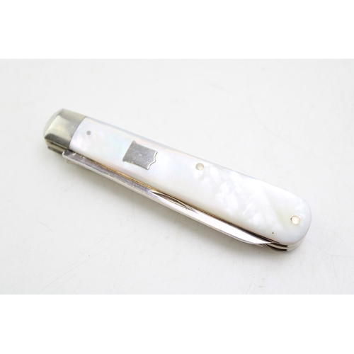 12 - A silver and mother of pearl travelling multi-tool pocket knife eating set, J Deakin and Sons, blade... 