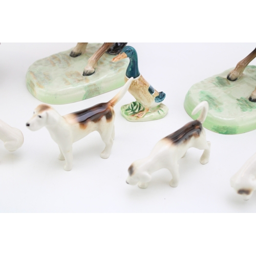 23 - Two Beswick rearing huntsman 868 together with four hounds, kingfisher and robin a/f, (Qty).
