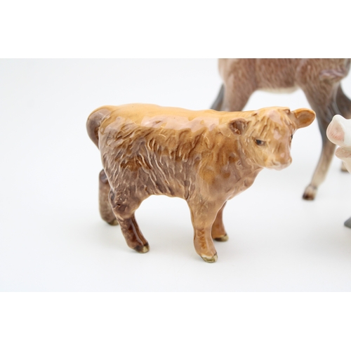 30 - Beswick animals to include Highland calf 1827, three donkeys together with the sitting pig 832,13cm ... 