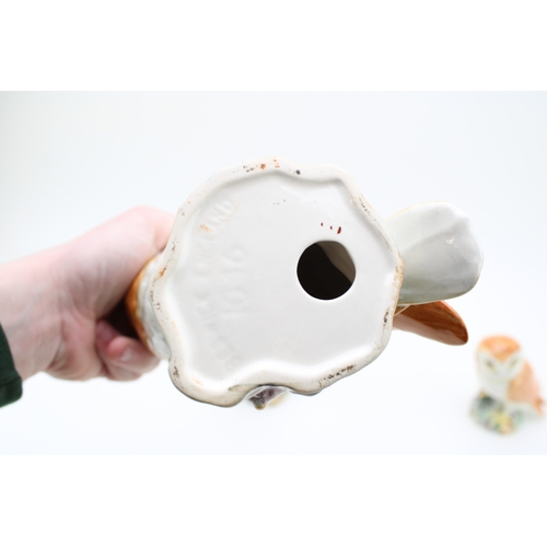 35 - Beswick barn owls to include large model 1046 together with two smaller versions, 18.5cm tall, (3).
