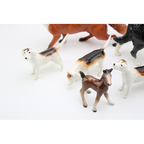36 - Beswick to include a large standing fox, a large collie, 3 fox hounds, a small standing fox and a sm... 