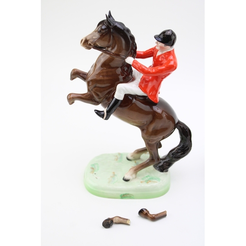 38 - A Beswick huntsman on brown horse, 1501, with a rearing huntsman 868 (2 - rearing huntsman legs af).