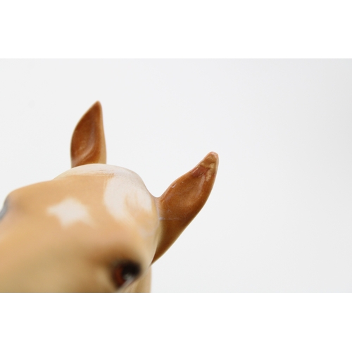40 - Beswick to include a large elephant with tusks and three Bois Roussell figures, in brown and matte g... 