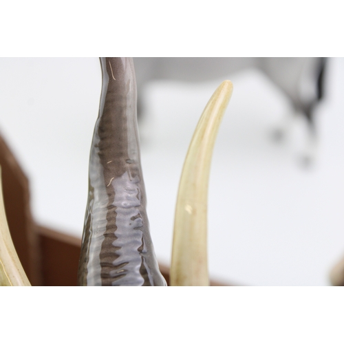 40 - Beswick to include a large elephant with tusks and three Bois Roussell figures, in brown and matte g... 