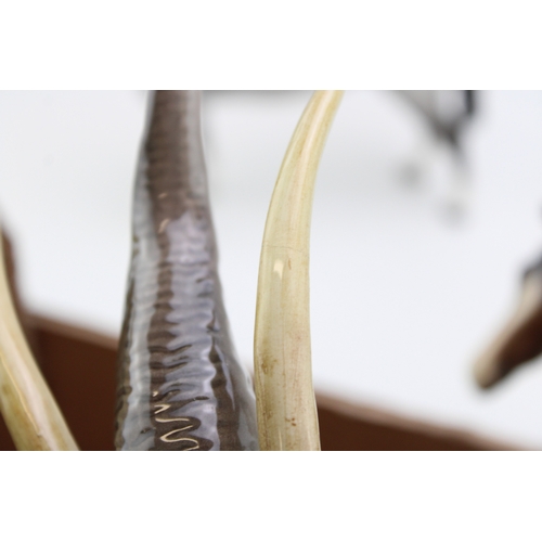 40 - Beswick to include a large elephant with tusks and three Bois Roussell figures, in brown and matte g... 