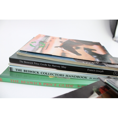 42 - An interesting collection of Beswick books and ephemera to include a 9th Edition Charlton price guid... 