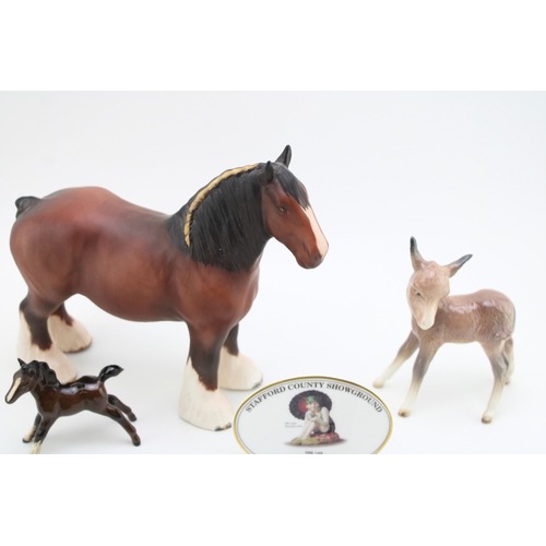 43 - Beswick to include a matt brown 818 shire, a sitting fox, a comical donkey foal, two points of sale ... 