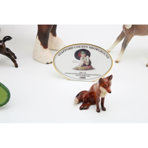 43 - Beswick to include a matt brown 818 shire, a sitting fox, a comical donkey foal, two points of sale ... 