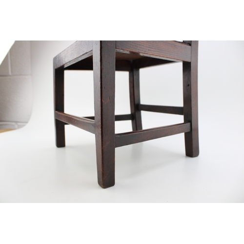 15 - A Georgian oak child's chair with vernacular sides, charming antique repair noted to reverse, 54cm t... 