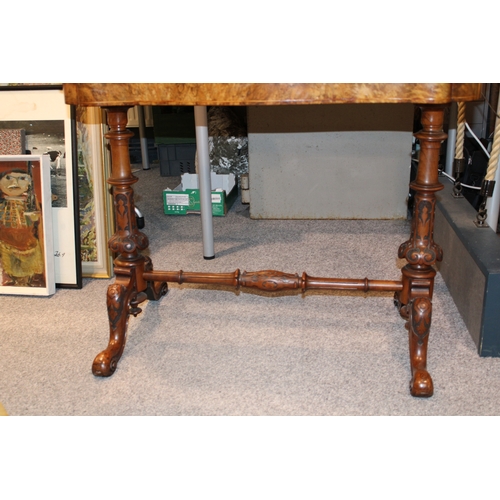 15A - A Victorian burr walnut stretcher card table, featuring serpentine-shaped top with walnut veneer and... 