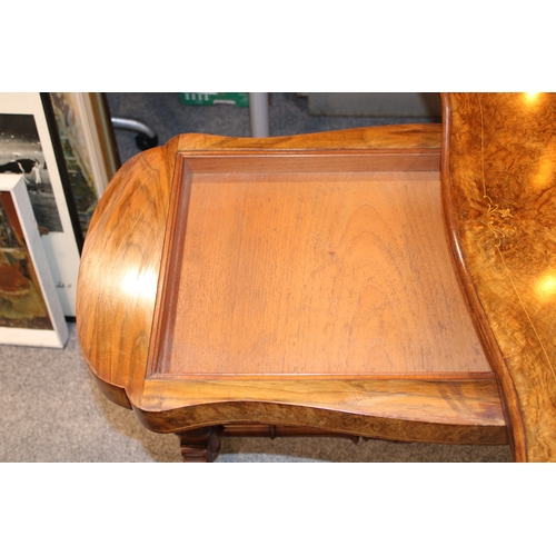 15A - A Victorian burr walnut stretcher card table, featuring serpentine-shaped top with walnut veneer and... 