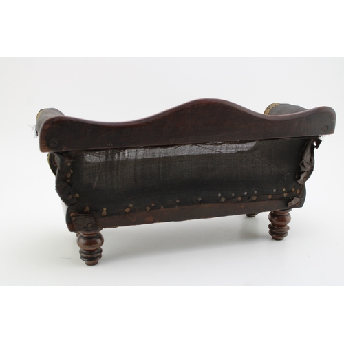 16 - A Regency miniature mahogany framed sofa with serpentine back and upholstered panel, raised on four ... 