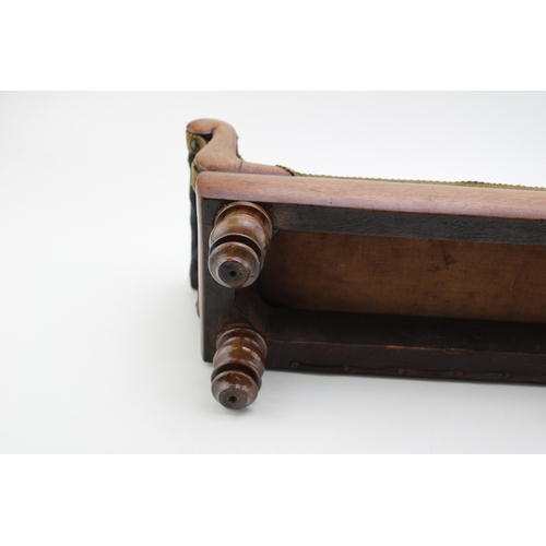 16 - A Regency miniature mahogany framed sofa with serpentine back and upholstered panel, raised on four ... 