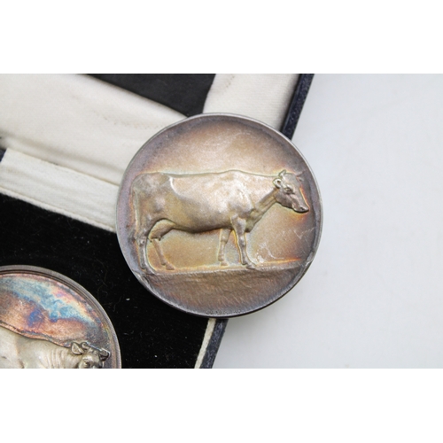 22 - A pair of silver medallions, both relating to the Gnosall & District Livestock Improvement Society, ... 