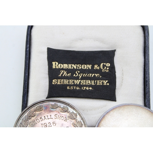 22 - A pair of silver medallions, both relating to the Gnosall & District Livestock Improvement Society, ... 