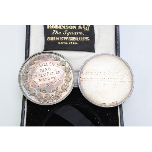 22 - A pair of silver medallions, both relating to the Gnosall & District Livestock Improvement Society, ... 