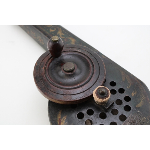 24 - A Georgian toleware mechanical fire bellows with turned handle, gilt-scrollwork on black background,... 