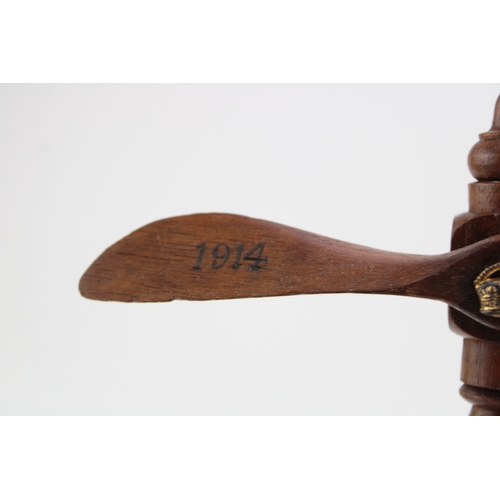 28 - Royal Flying Corps: a wooden propeller stand / trophy, with the an RFC cap badge mounted to the base... 