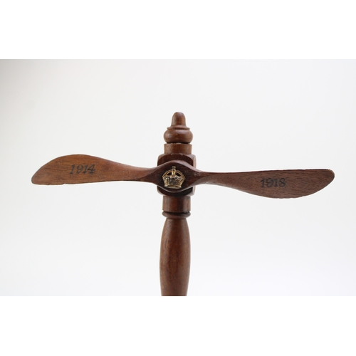 28 - Royal Flying Corps: a wooden propeller stand / trophy, with the an RFC cap badge mounted to the base... 