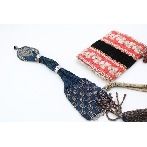 34 - Eight 19th century ‘miser’s purses’, comprising cotton examples in a variety of colours with cut and... 