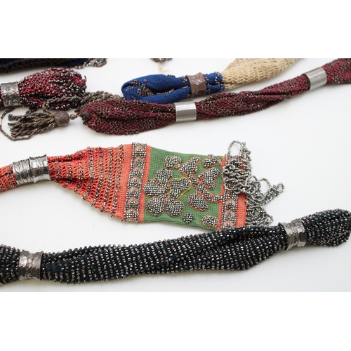 35 - Ten 19th century ‘miser’s purses’, comprising cotton examples in a variety of colours with cut and p... 