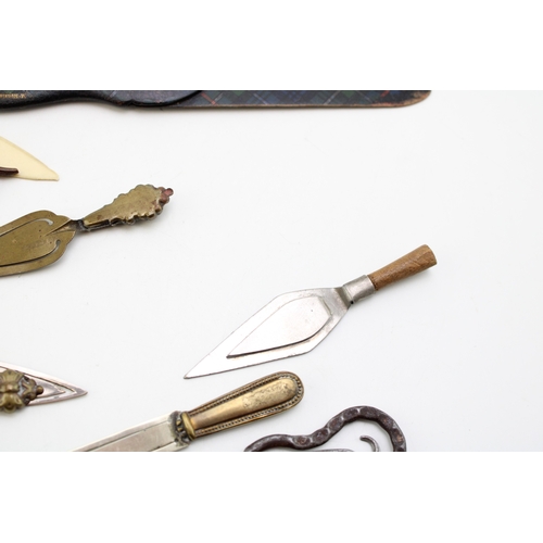 37 - A collection of 'bookmarks' comprising agate set examples on brass and base metal, tartan-ware (in t... 